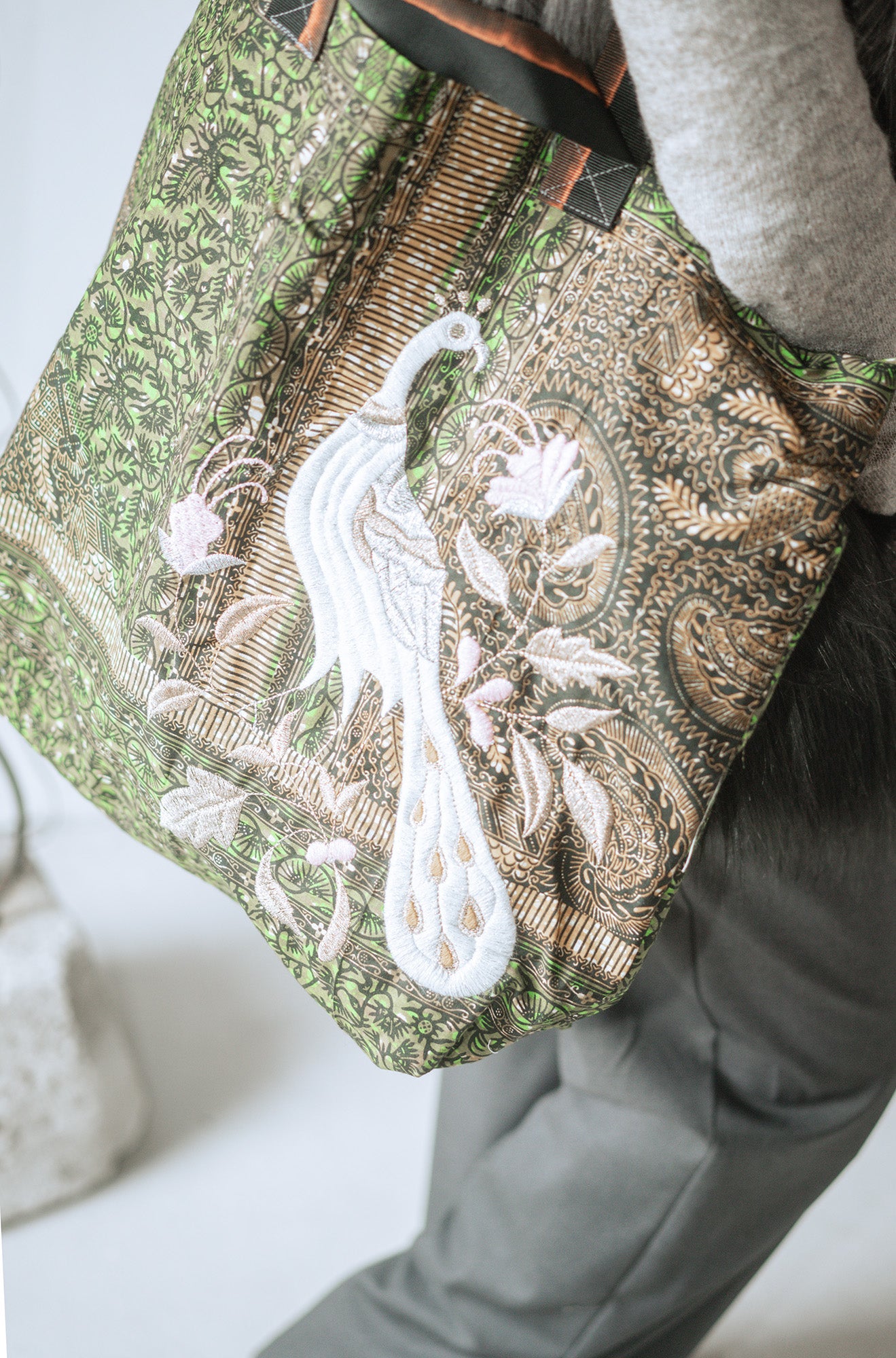 A green wax Prayers bag