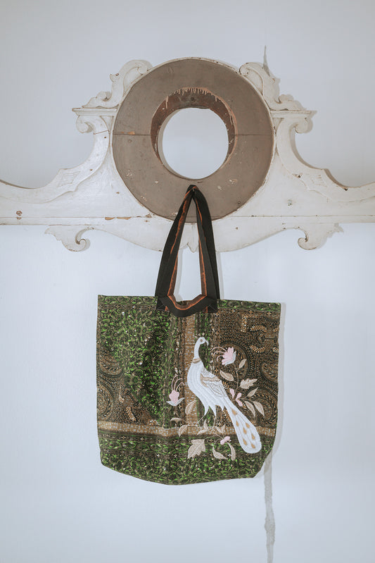 A green wax Prayers bag