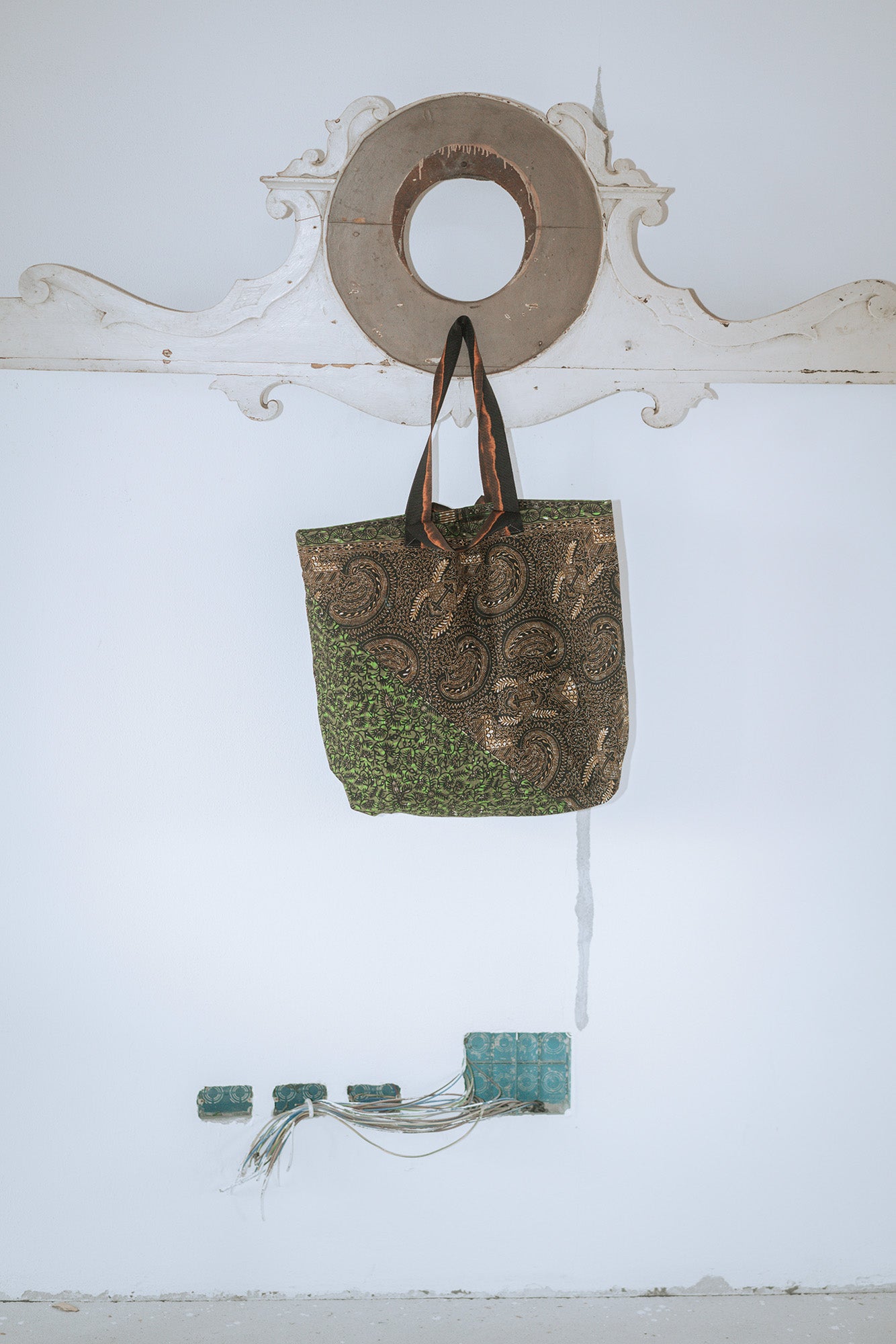 A green wax Prayers bag