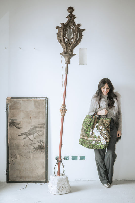 A green wax Prayers bag